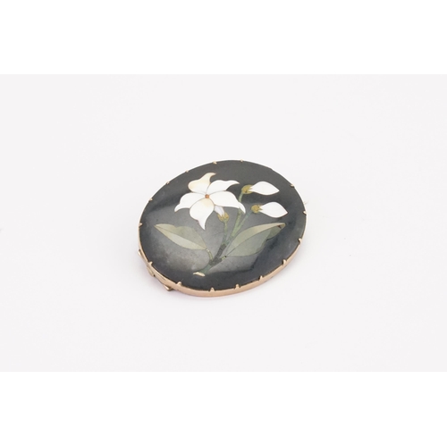 136 - An Antique Victorian Pietra Dura Brooch, in a silver mount.