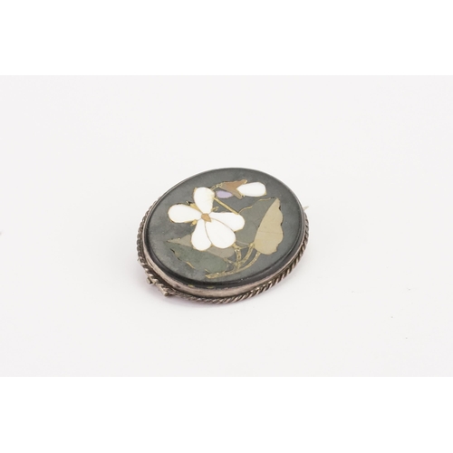 139 - An Antique Victorian Pietra Dura Brooch, silver mounted. 3cm x 2cm.