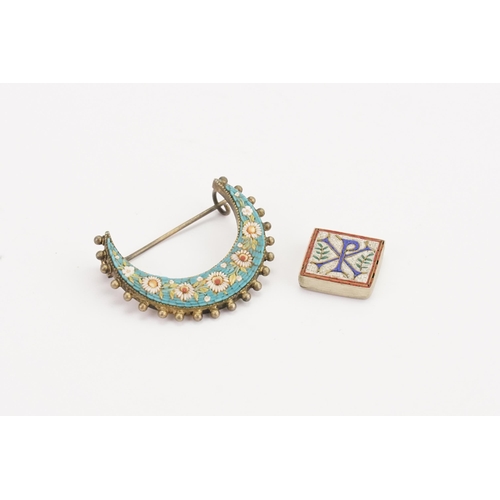 155 - A micro mosaic half moon brooch, along with an insignia tile.