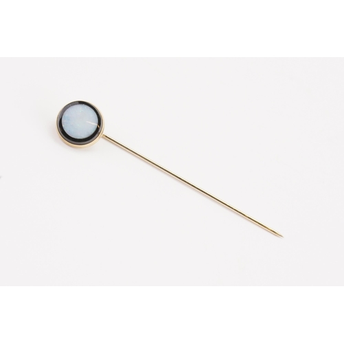 157 - A 14ct gold onyx and opal stick pin. Weight 1.6g.