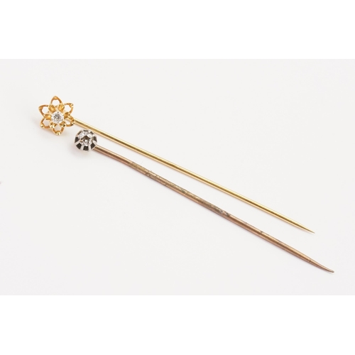 162 - A diamond stick pin, along with another diamond set stick pin.