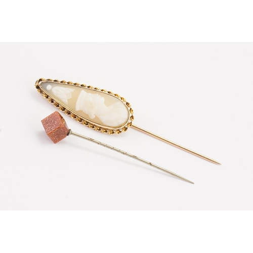 170 - A 9ct gold G & G marked cameo stick pin, along with one other.