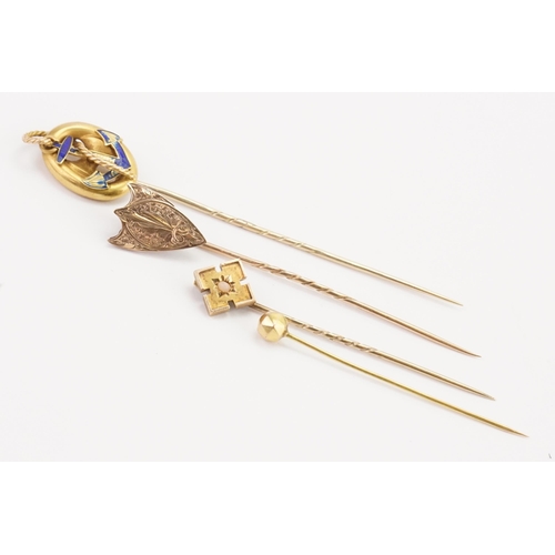 173 - A blue enamelled anchor stick pin, along with a shield stick pin and two others.