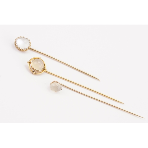 184 - A 14ct gold stick pin, along with two others.