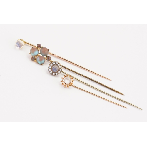 185 - Moon stone and pearl set stick pins.