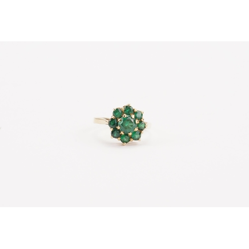 195 - A 9ct gold green stone ring. Set with 9 green stones. Weight 3.5g . Size Q.