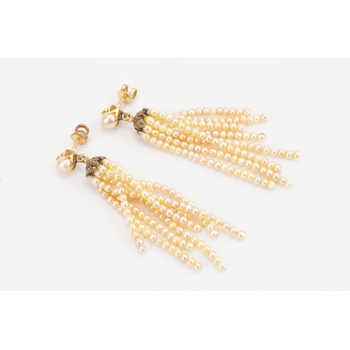 198 - A pair of gold mounted pearl set drop earrings, in the tassel design.