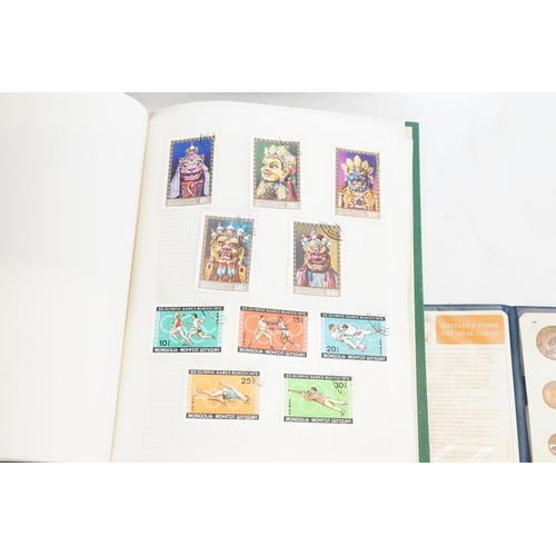 471 - Two Stamp Albums along with a Decimal Coin Set.