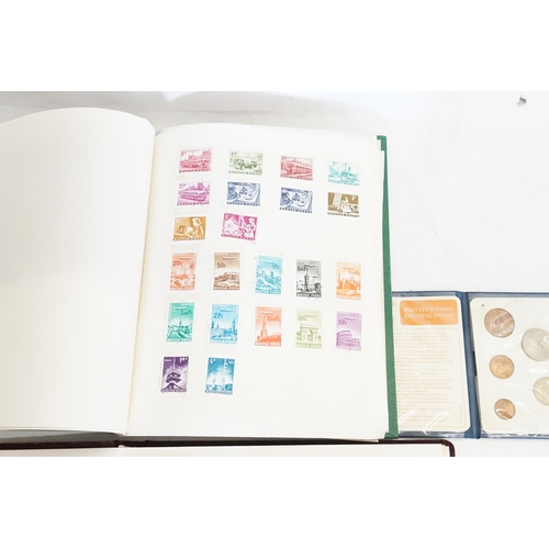 471 - Two Stamp Albums along with a Decimal Coin Set.