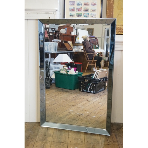 659 - A large modern mirror. Measuring: 80cms x 120cms.