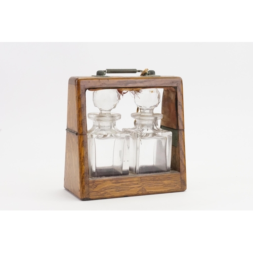 523 - A Gentleman's Travelling Tantalus with two small Bottles & Front Opening Side. Measuring: 14cms acro... 