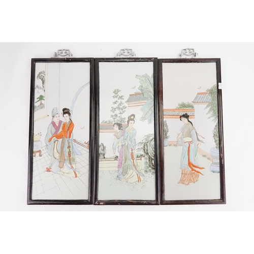 855 - A Set of Three Chinese Porcelain painted panels decorated with elegant young ladies in garden settin... 