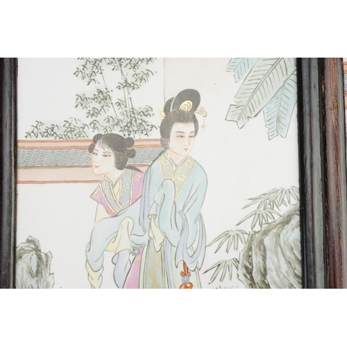 855 - A Set of Three Chinese Porcelain painted panels decorated with elegant young ladies in garden settin... 