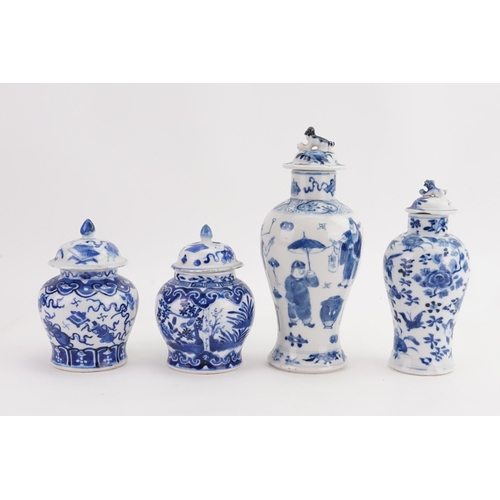 864 - Two Blue & White Ginger Jars with Covers & two vases decorated with a street scene, umbrella vendor,... 