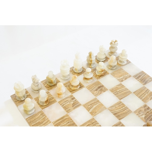 536 - An Onyx & Marble Chess Set of turned form. Board Measuring: 44cms x 44cms. AF. A few pieces require ... 