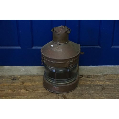 739 - A Copper mounted & Glass Mast Head Lamp with Reflector & Swing Handle. Measuring: 56cms high.