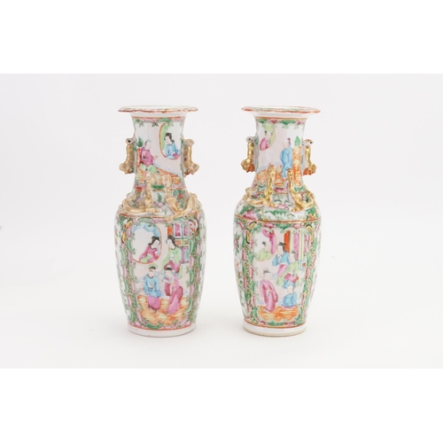 901A - A pair of mid-19th century Canton Famille rose porcelain vases. Decorated with dragon handles and st... 