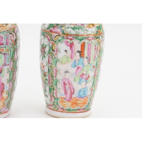 901A - A pair of mid-19th century Canton Famille rose porcelain vases. Decorated with dragon handles and st... 