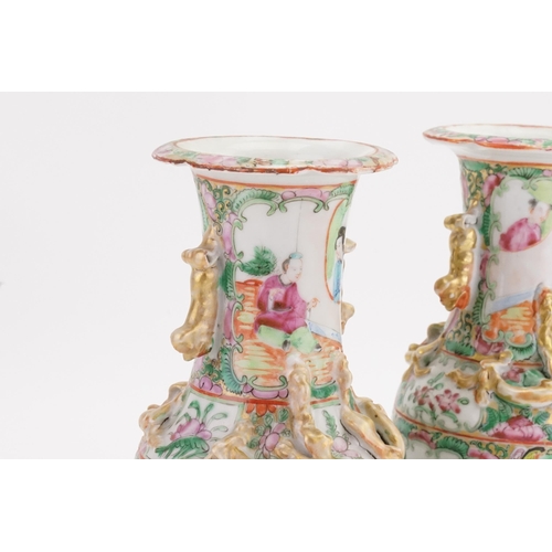 901A - A pair of mid-19th century Canton Famille rose porcelain vases. Decorated with dragon handles and st... 