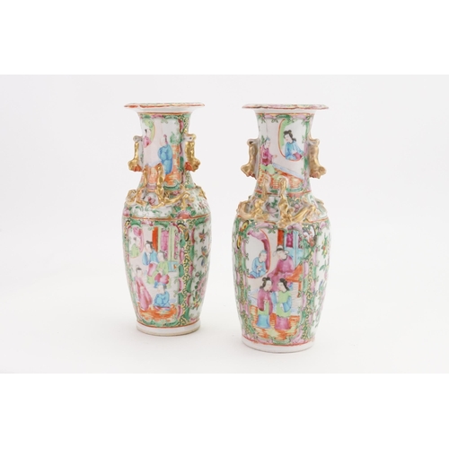 901A - A pair of mid-19th century Canton Famille rose porcelain vases. Decorated with dragon handles and st... 