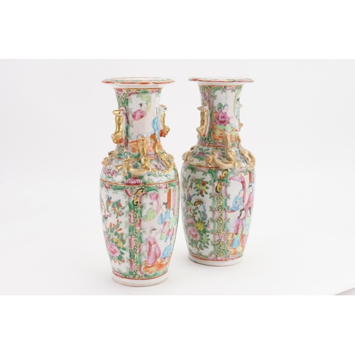 901A - A pair of mid-19th century Canton Famille rose porcelain vases. Decorated with dragon handles and st... 