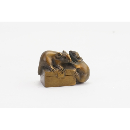 909A - A 19th Century Japanese Netsuke boxwood decorated with rats. 5cm. Signed.