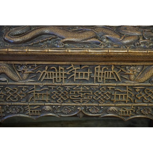 651 - A Carved Dragon & Sun designed Chinese Desk with Bamboo edging design & Camphor inlay. Measuring: 86... 