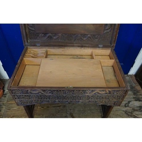 651 - A Carved Dragon & Sun designed Chinese Desk with Bamboo edging design & Camphor inlay. Measuring: 86... 