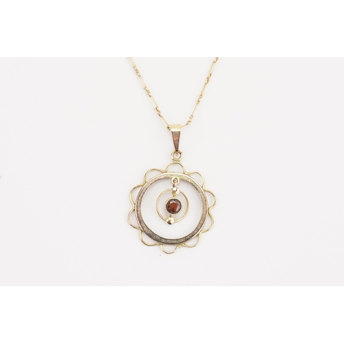 123 - A 9ct gold Victorian drop pendant, set with a garnet hung on a 9ct gold chain. Weight 2.8g.