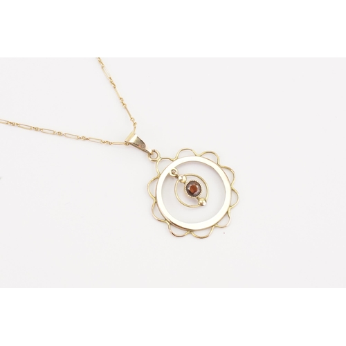 123 - A 9ct gold Victorian drop pendant, set with a garnet hung on a 9ct gold chain. Weight 2.8g.