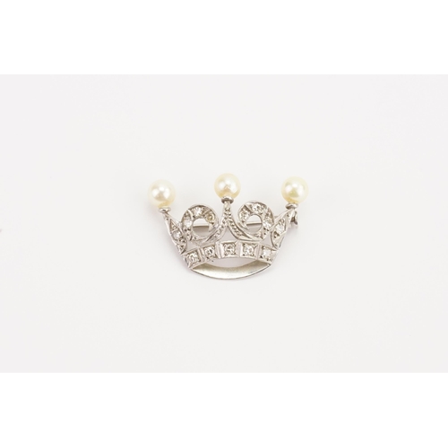 58 - A diamond and pearl set brooch, designed as a crown. Set with 13 diamonds (largest 0.03ct). Weight 3... 