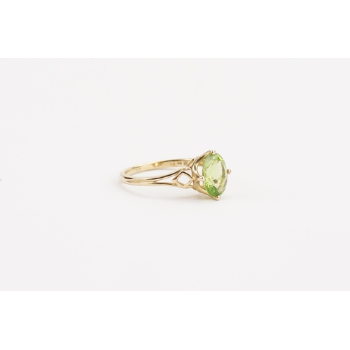 64 - A 9ct green stone set ring. Stone approximately 9.6mm x 7.2mm. Weight 2.8g. Size S.