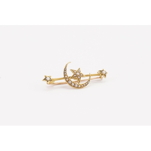 66 - A 15ct gold and seed pearl set moon & stars brooch. Weight 2.8g.