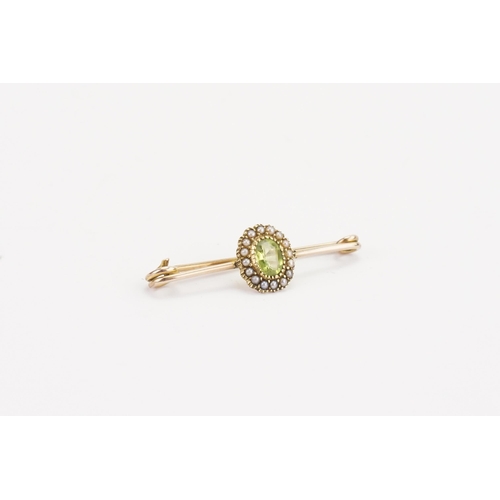 129 - A 15ct gold seed pearl and tourmaline set brooch. Weight 2.1g.