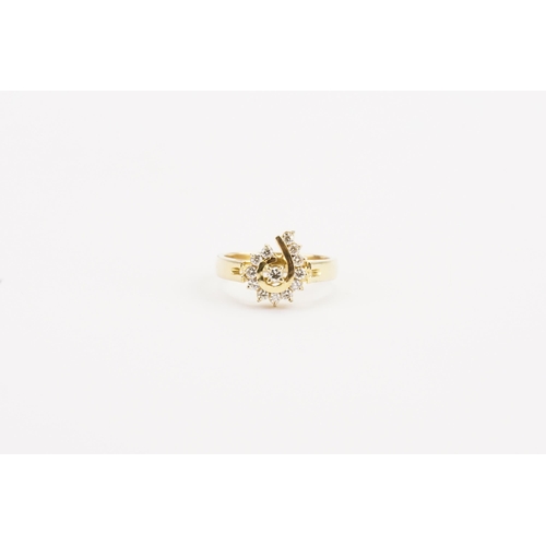 130 - A 14ct gold diamond set ring. Set with approximately 13 diamonds. Weight 4.3g. Size M.