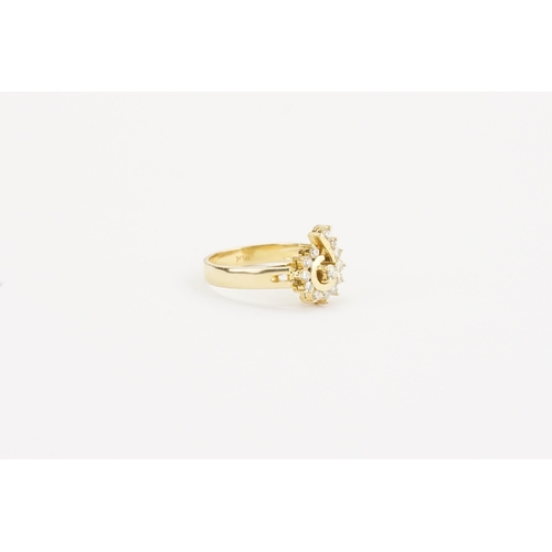 130 - A 14ct gold diamond set ring. Set with approximately 13 diamonds. Weight 4.3g. Size M.