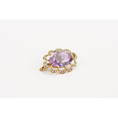 135 - A 15ct gold amethyst and seed pearl set brooch. Amethyst approximately 19mm x 14.4mm. Weight 6.3g.