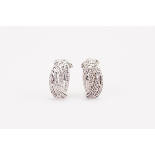 45 - A pair of White Gold and diamond set earrings, set with approximately 30 brilliant and approximately... 