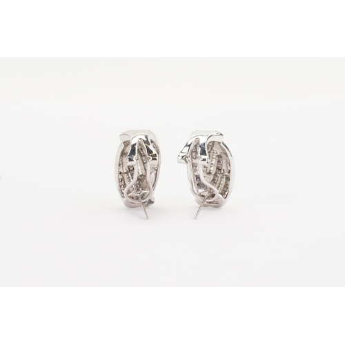 45 - A pair of White Gold and diamond set earrings, set with approximately 30 brilliant and approximately... 