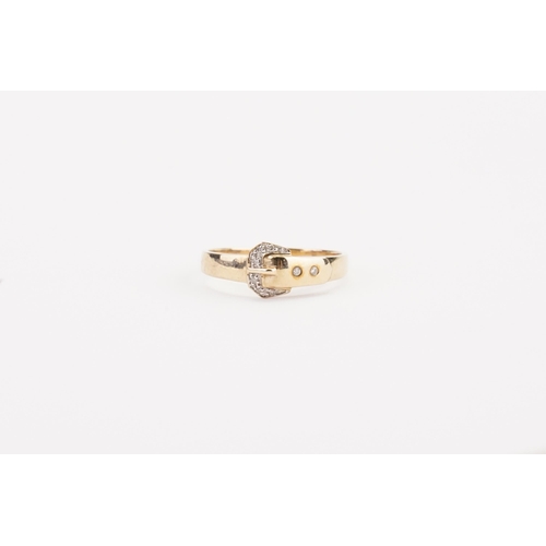 98 - A 9ct gold diamond buckle design ring. Size V. Weight 2.7g.