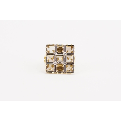 138 - A 585 marked gold ring, set with 9 smoky quartz and four diamonds. Weight 6.4g. Size P.