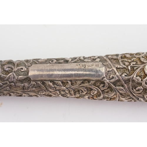 179 - A Italian possible Irvestito 925 hallmarked walking stick, topped with a silver embossed design. Sta... 