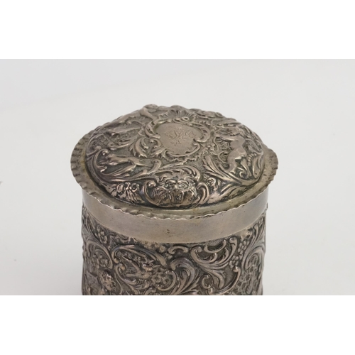 13 - An Edwardian Circular Silver die stamped & embossed Cherub Dressing Table Box. Maker: WCJL, London b... 