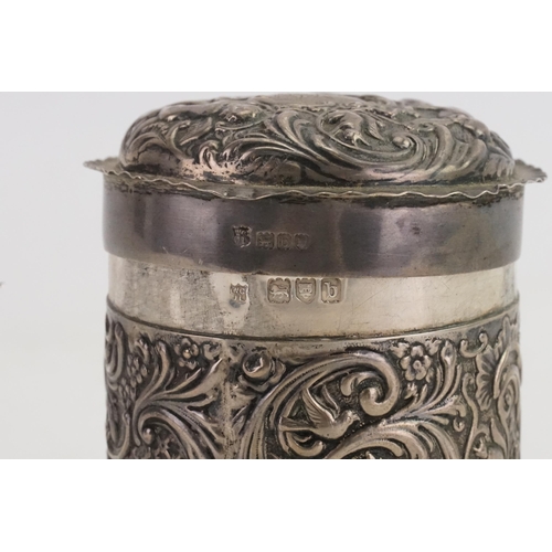 13 - An Edwardian Circular Silver die stamped & embossed Cherub Dressing Table Box. Maker: WCJL, London b... 