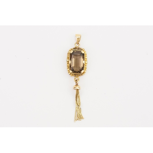 114 - A unmarked smoky quartz pendant hung with a tassel. Hung on a gold Chain. Weight 5g.