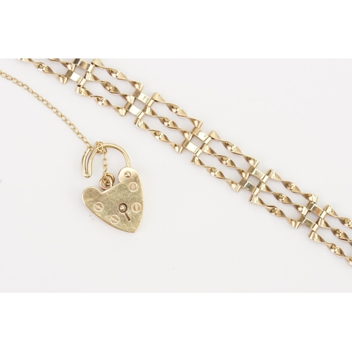 162 - A 9ct gold gate bracelet, set with a love heart lock. Weight 8.7g.