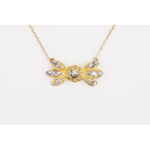 83 - A British colonial style high carat gold and rose cut diamond set necklace, designed as a bow format... 