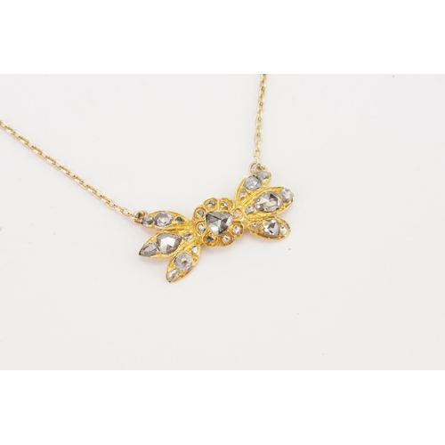 83 - A British colonial style high carat gold and rose cut diamond set necklace, designed as a bow format... 