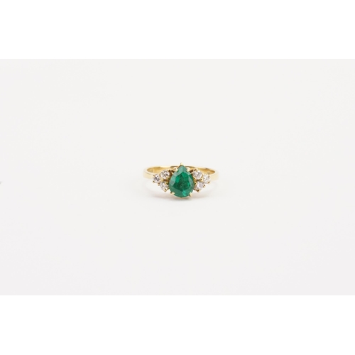 84 - A 18ct gold pear shaped emerald and diamond set ring by Garrard, set with 1.1ct pear shaped emerald,... 