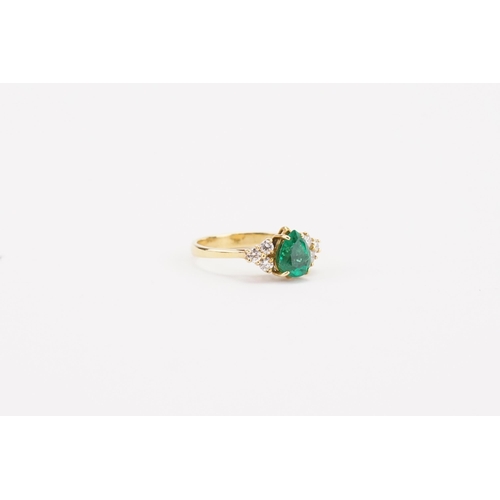 84 - A 18ct gold pear shaped emerald and diamond set ring by Garrard, set with 1.1ct pear shaped emerald,... 